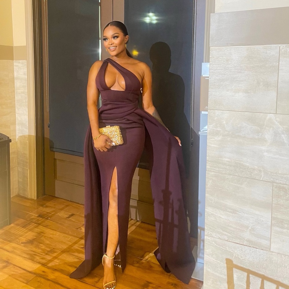 Asymmetric dress in aubergine thigh-high slit